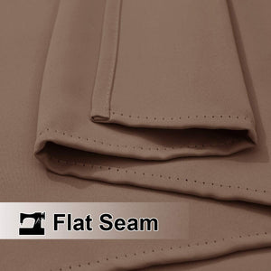Close-up of taupe fabric featuring a neat, precisely stitched flat seam for quality construction.