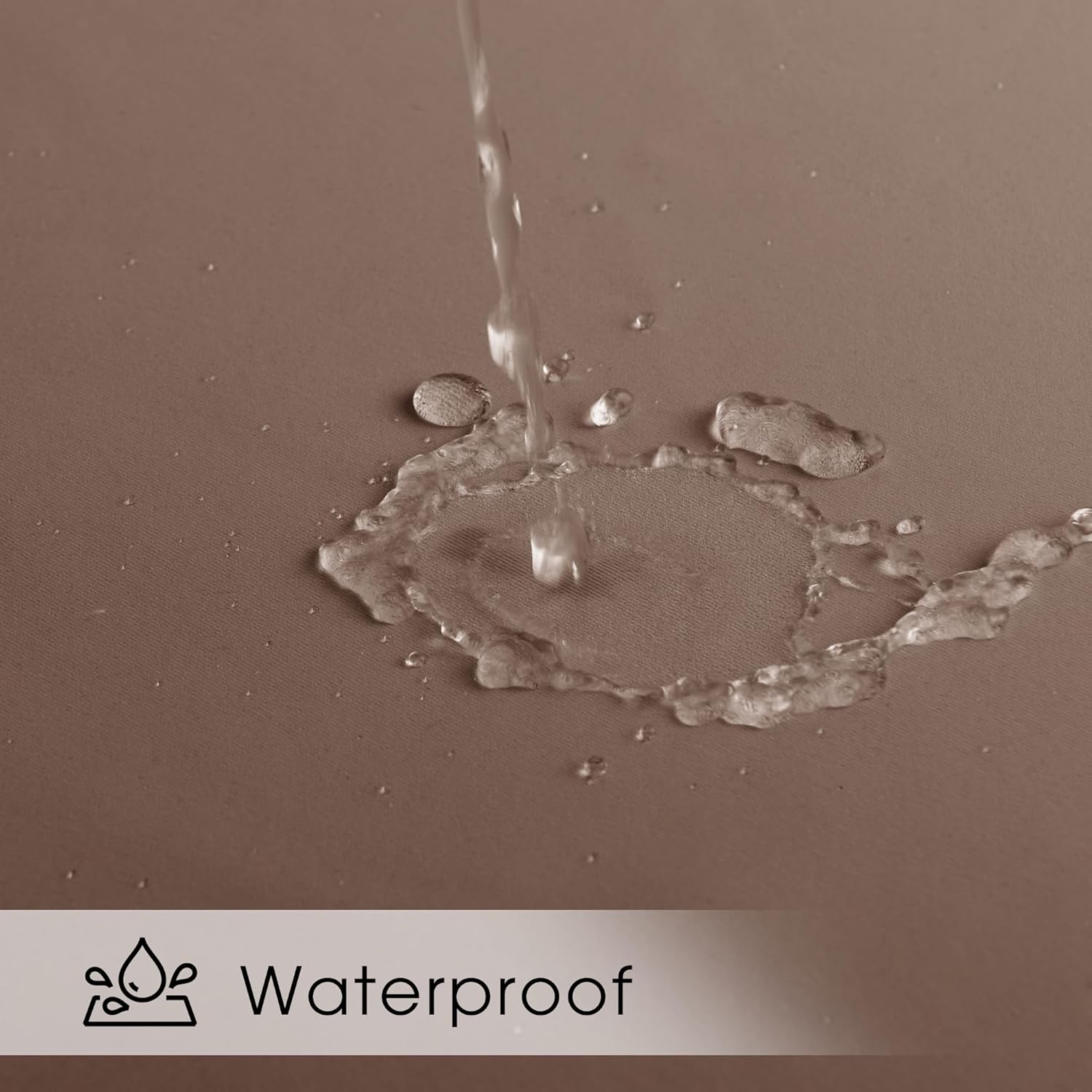 Close-up of water beading and pooling on a taupe fabric surface, demonstrating its waterproof quality.