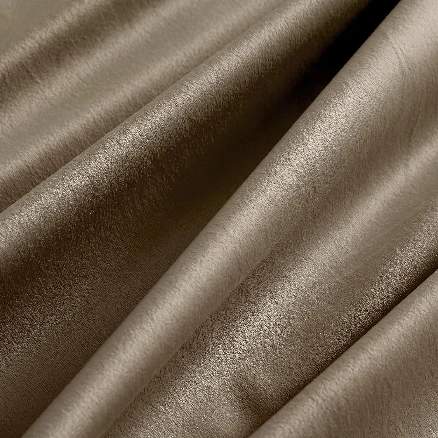 Close-up of taupe faux leather fabric with soft folds and a smooth matte sheen