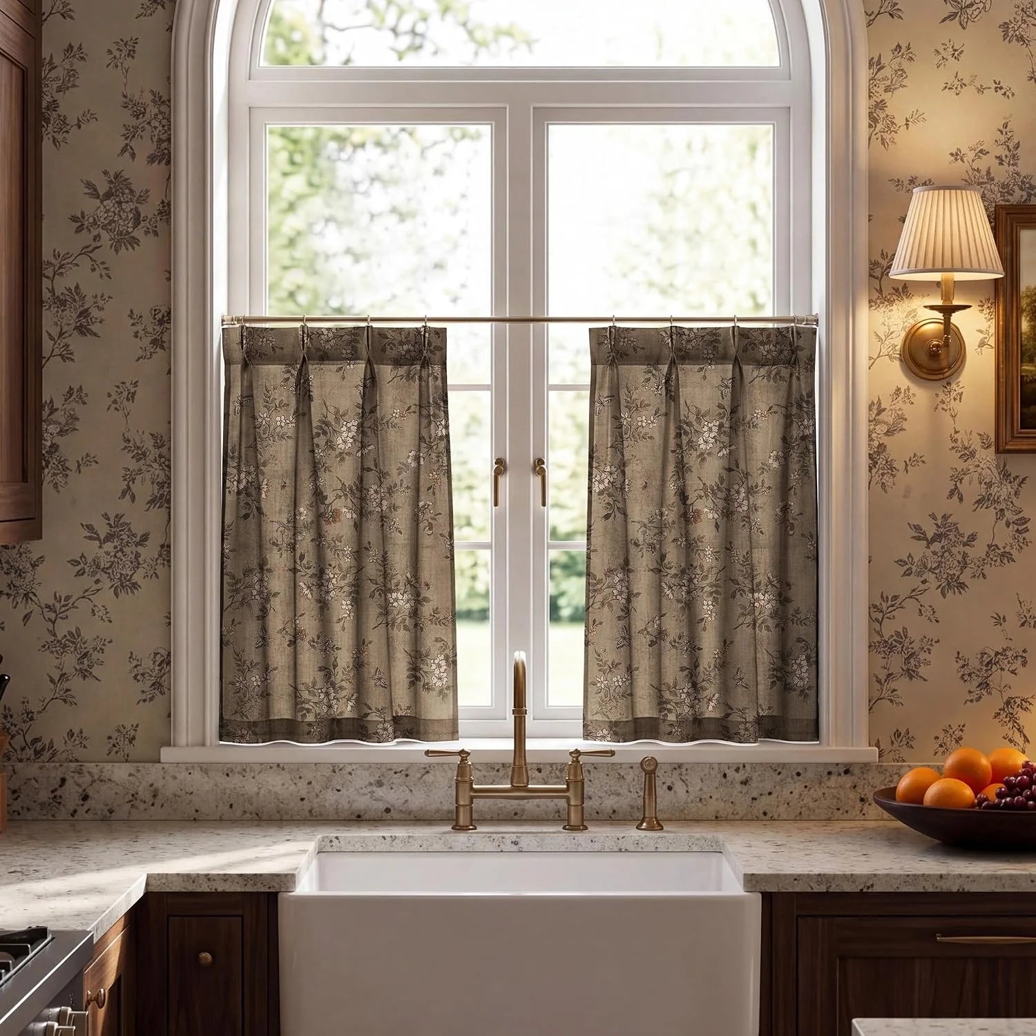 Taupe floral cafe curtains on an arched kitchen window above a farmhouse sink