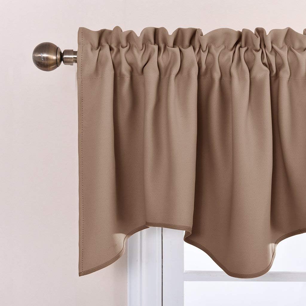 Warm taupe gathered rod pocket valance with a scalloped bottom edge hung on a decorative rod.