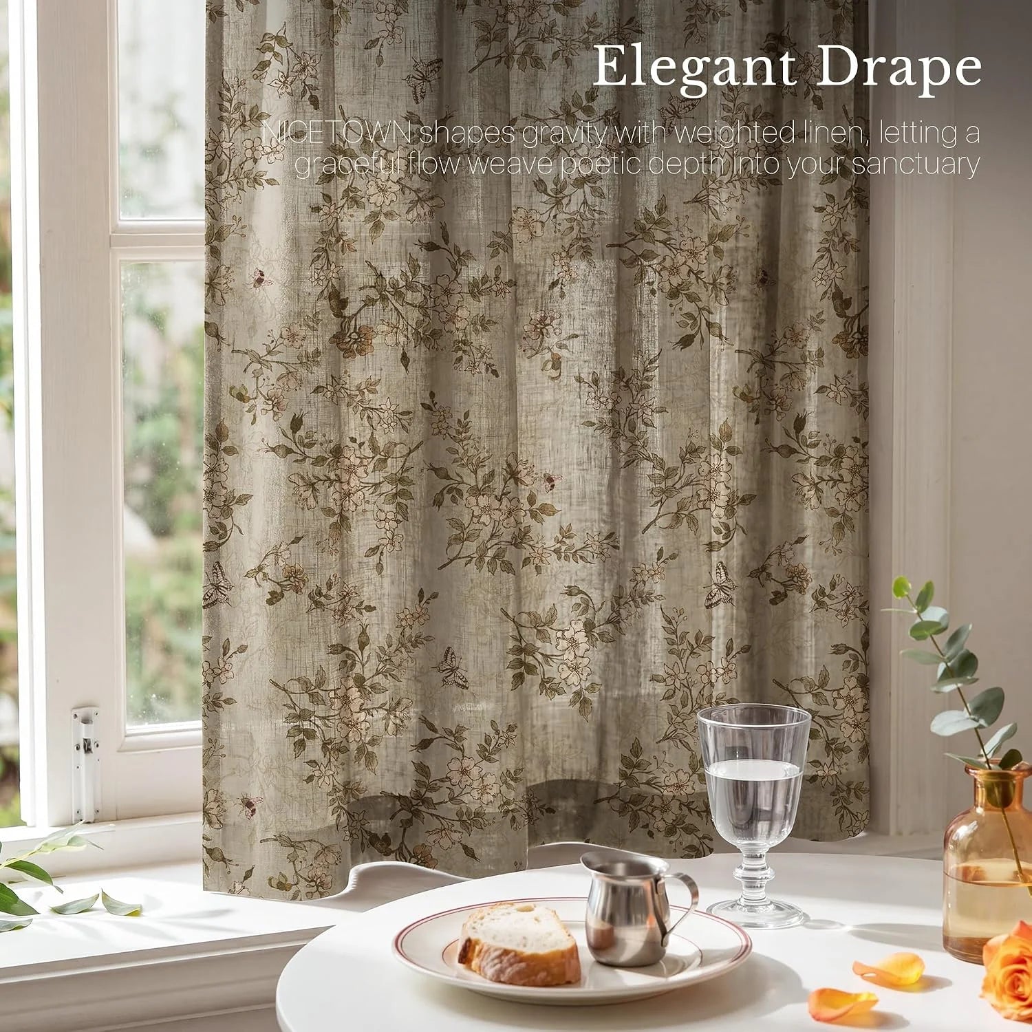 Taupe linen floral cafe curtain hanging by a bright window above a small breakfast table
