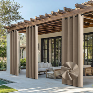 Taupe outdoor grommet curtains on a wooden pergola, offering patio shade. Close-up shows textured fabric.