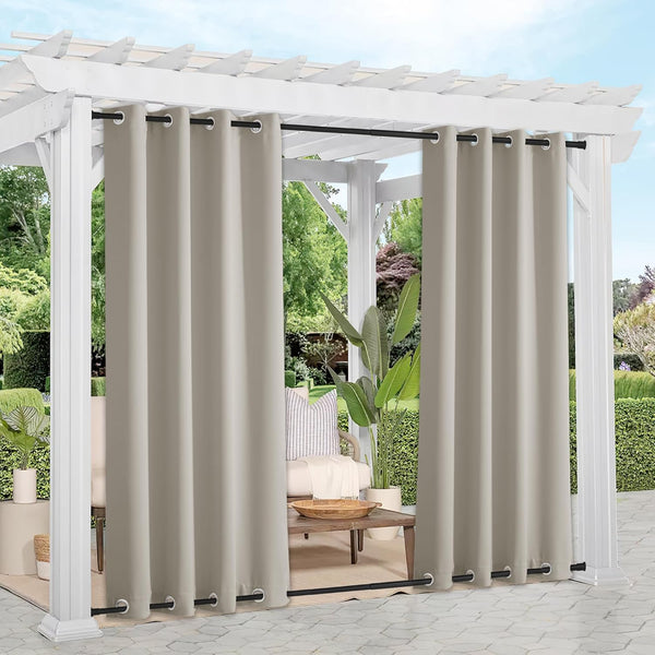 Taupe outdoor grommet curtains hanging from a white pergola, providing privacy and shade.