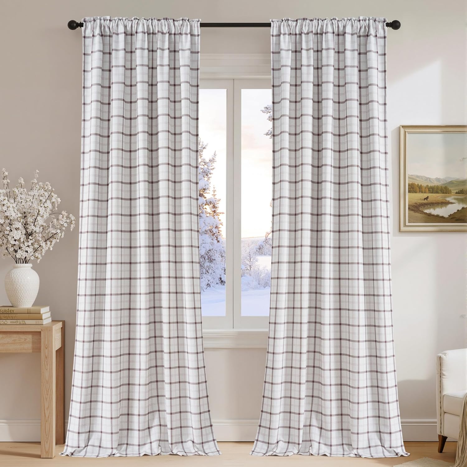 Off-white curtains with a taupe plaid pattern and gathered rod pocket top, hung in a cozy living room.