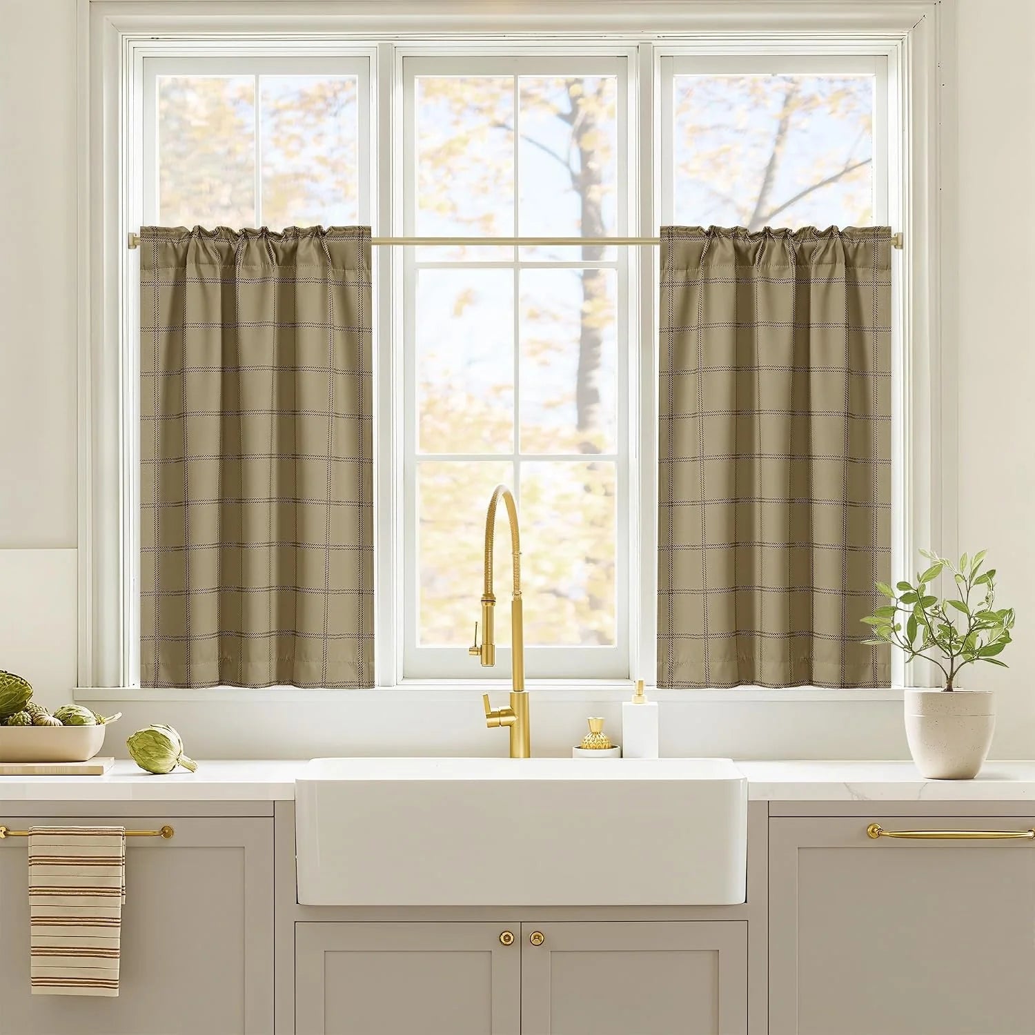 Taupe plaid tier curtains on white kitchen window above farmhouse sink