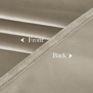 Detailed view of two-sided taupe fabric with soft, plush front and distinct woven back material.