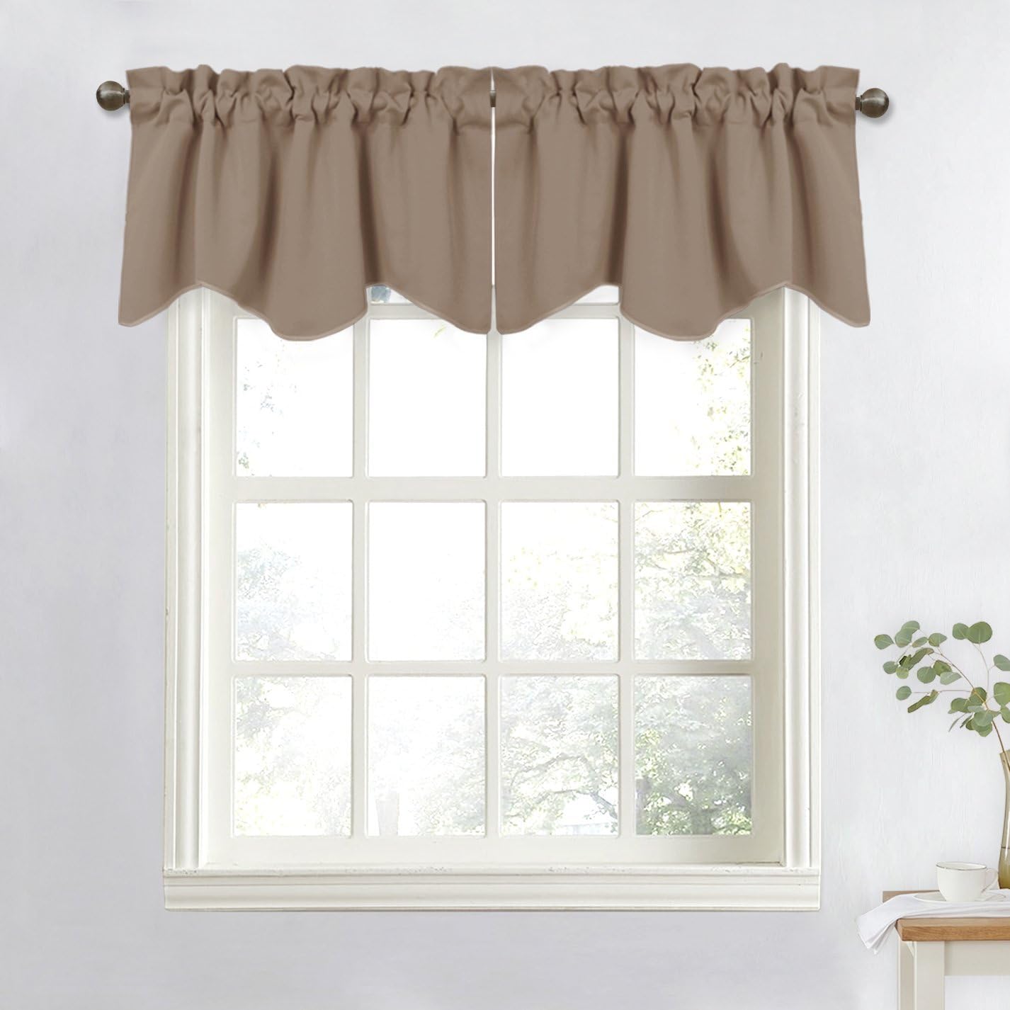 Taupe scalloped valance with a gathered rod pocket top, elegantly covering a white paned window.