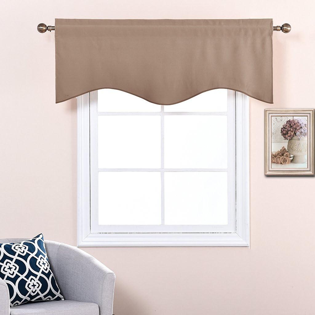 Taupe window valance with decorative scalloped bottom edge, hung on a bronze rod above a white window.