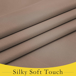 Close-up of taupe silky soft woven fabric folded neatly, revealing smooth texture and gentle drape.