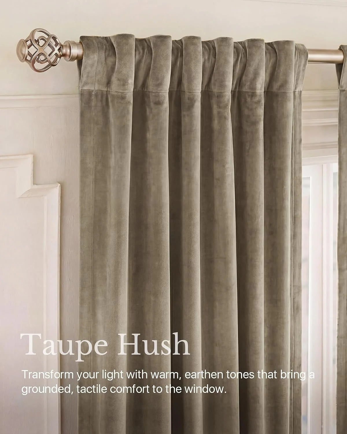 Taupe velvet curtain panel with soft pleats on a brushed metal rod by a window