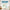 Teal blue rod pocket valance with scalloped edge over kitchen window, smooth fabric.