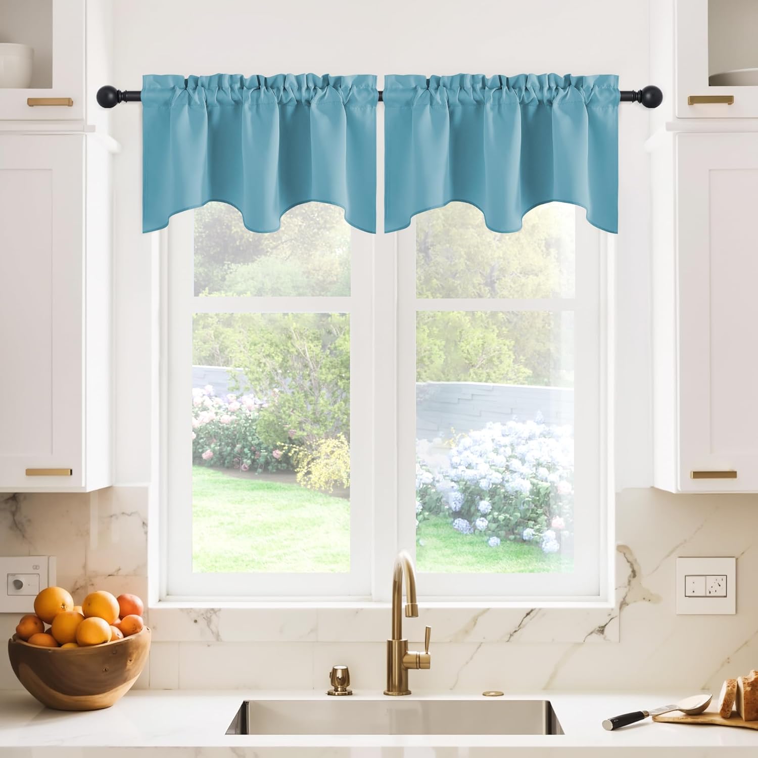 Teal blue rod pocket valance with scalloped edge over kitchen window, smooth fabric.