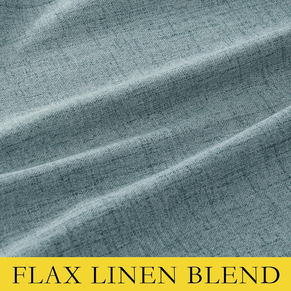 Close-up of teal flax linen blend fabric showing visible woven texture and soft drapes.