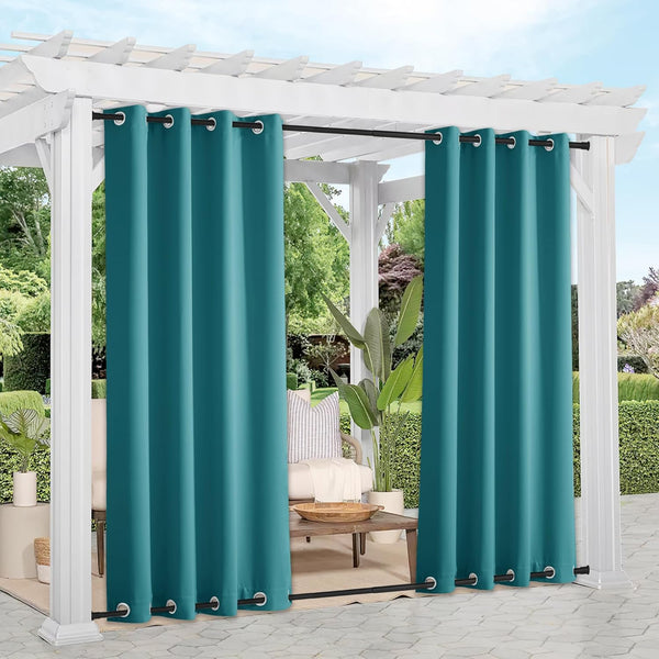 Teal outdoor privacy curtains with grommet tops and bottom rod, hung on a white pergola over a patio.