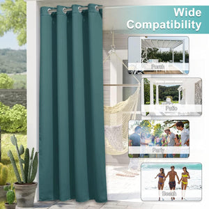 Teal outdoor curtain panel with silver grommets hanging on a patio, providing shade and privacy.