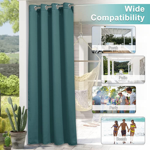 Teal outdoor curtain panel with silver grommets hanging on a patio, providing shade and privacy.