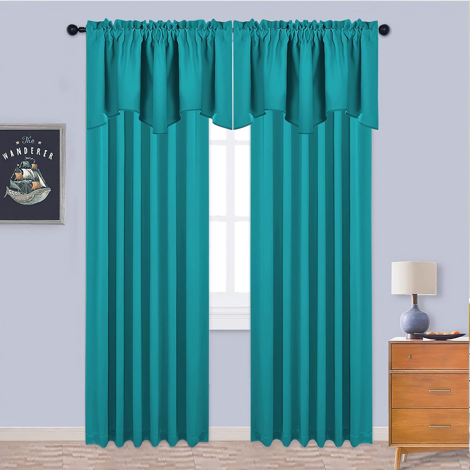 Vibrant teal rod pocket window curtains with a gathered top and layered valance, hanging over a bright window.