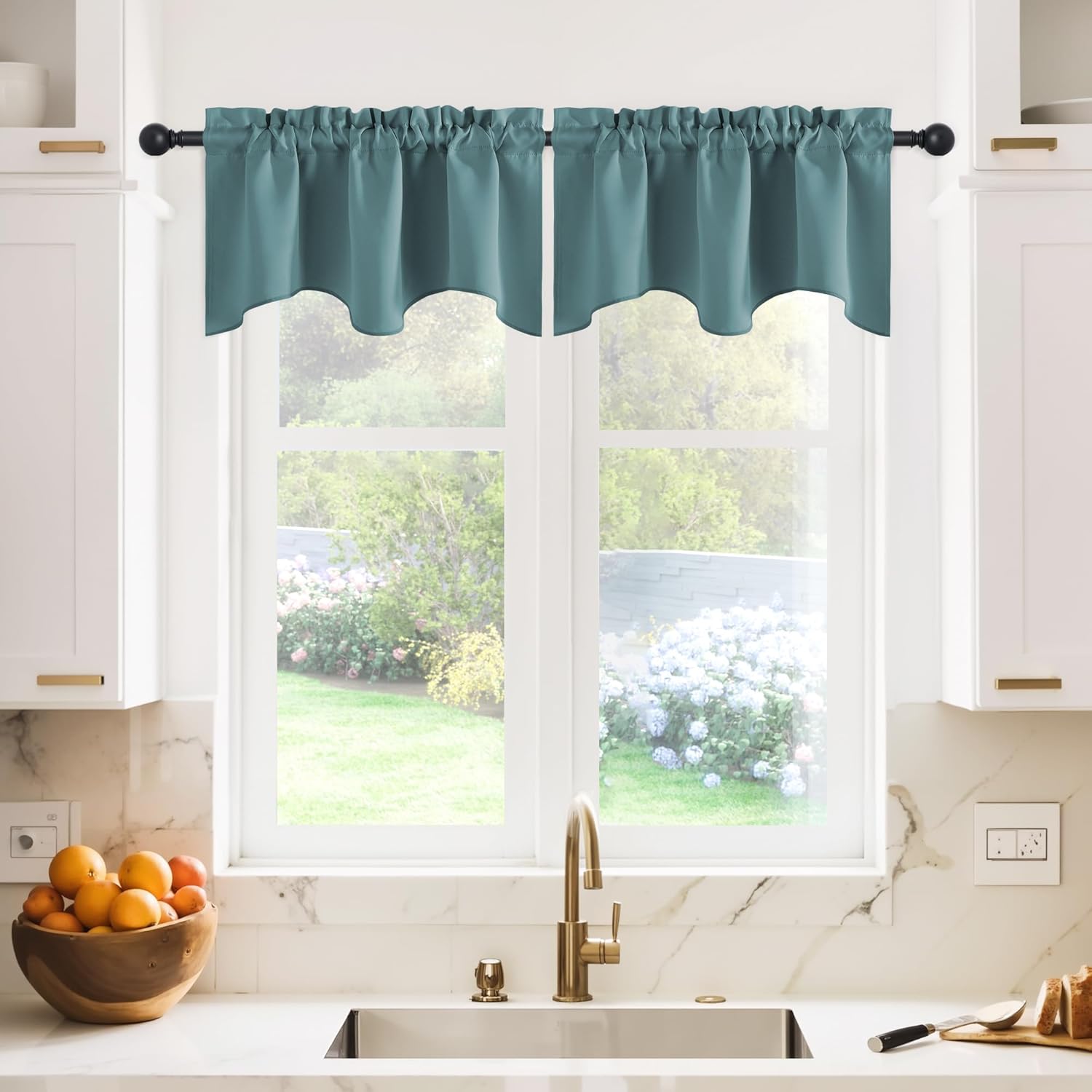 Smooth teal fabric valances with a scalloped bottom edge and gathered rod pocket in a kitchen.