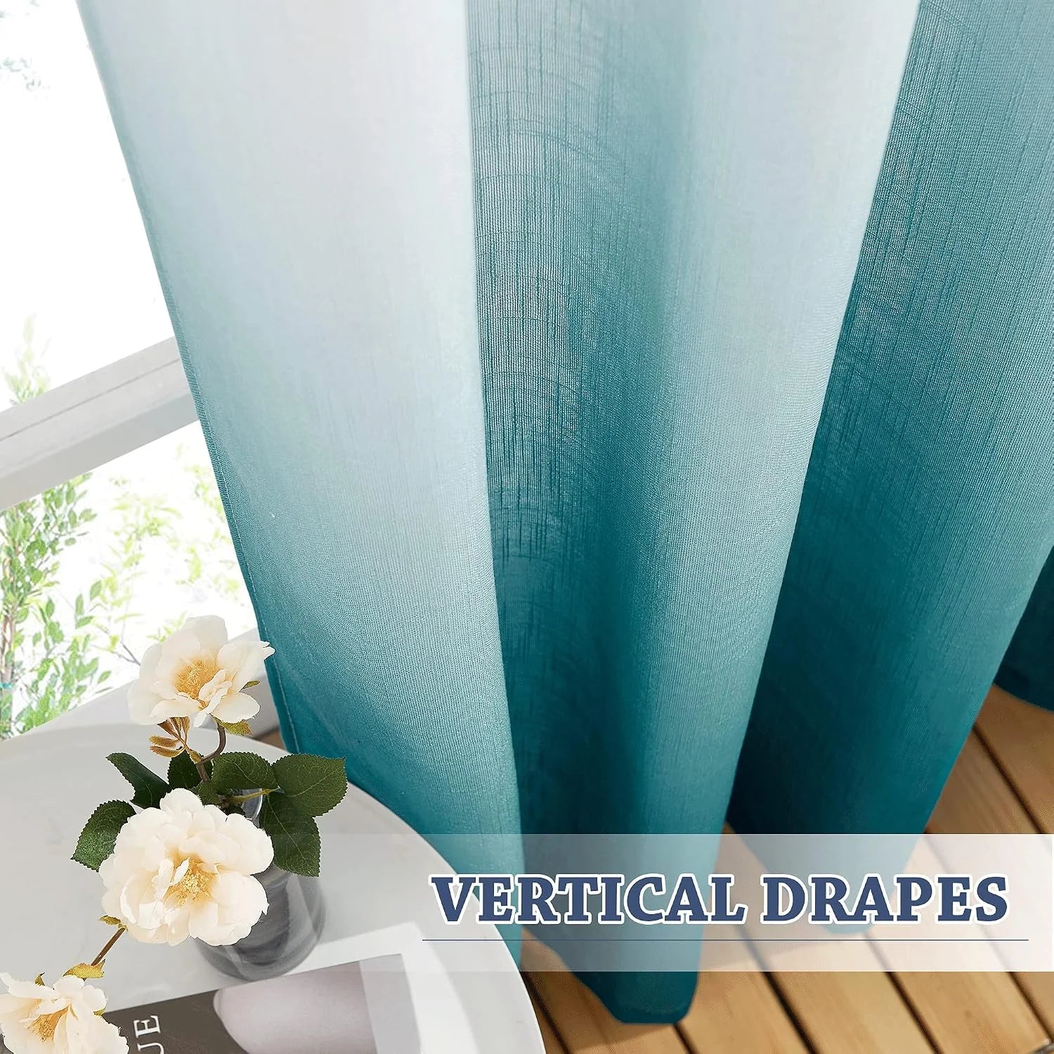 Teal sheer linen-look curtains hanging in soft vertical drapes by a bright window