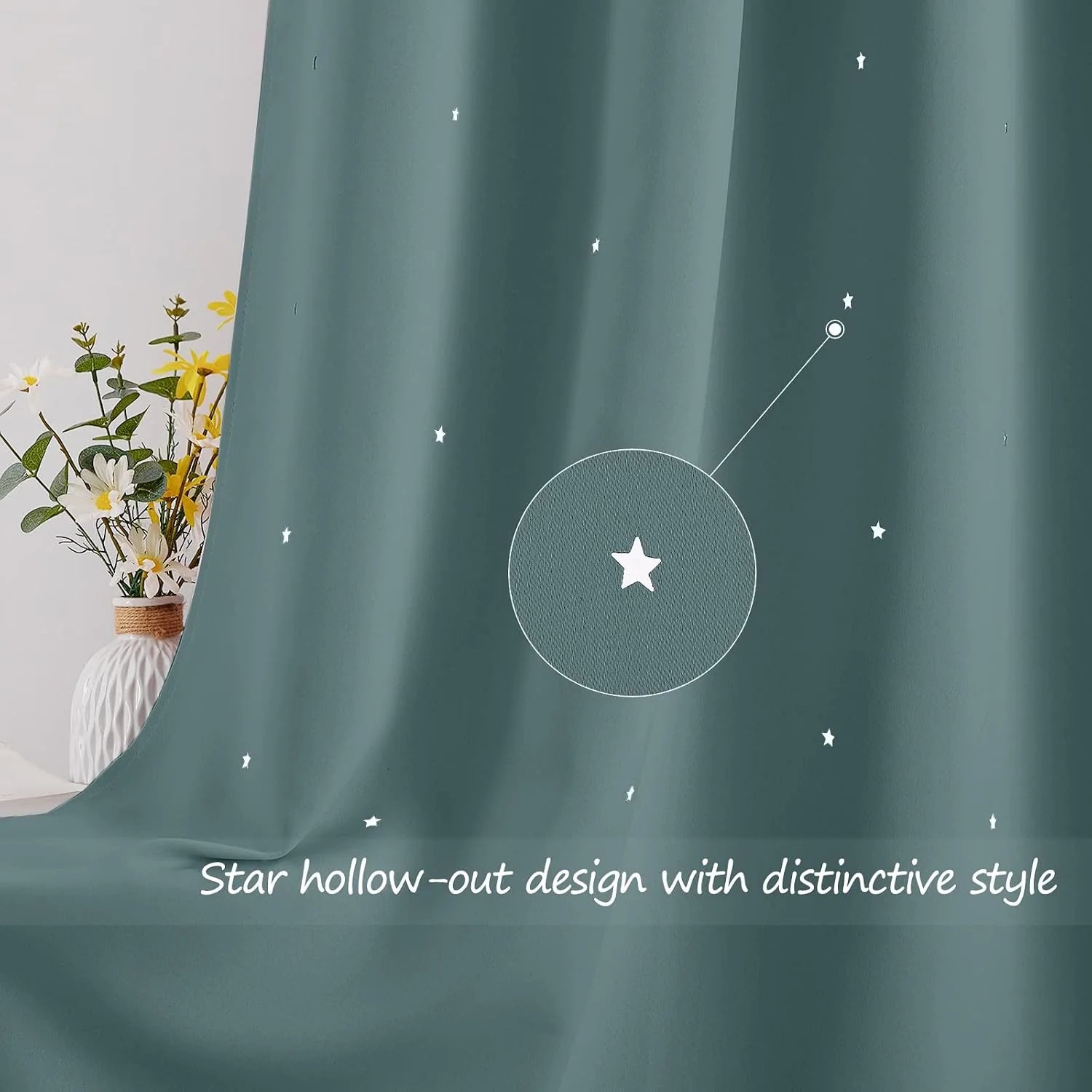 Teal blackout curtain with small white star cutout pattern and soft drape detail