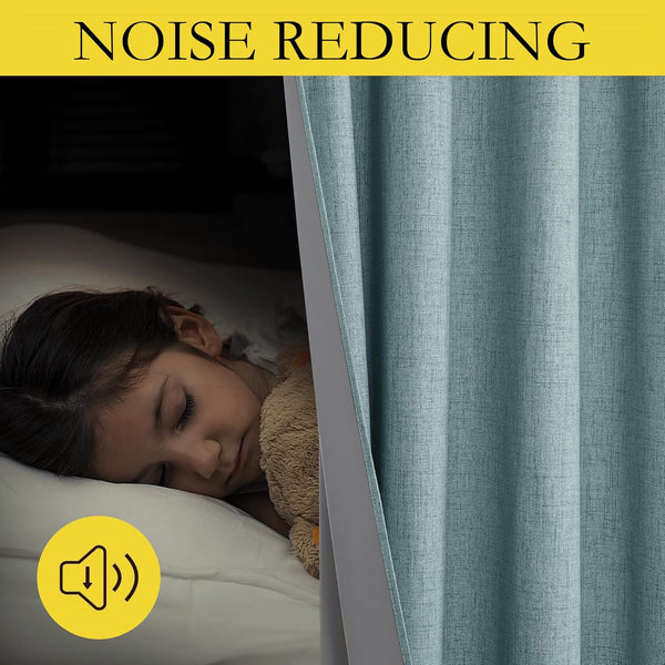 Teal textured noise reducing blackout curtain partially open, revealing a child sleeping soundly in a dark room.