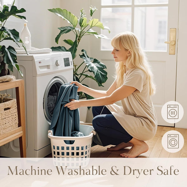 Woman loads soft dark teal fabric into washing machine. Product is machine washable and dryer safe.