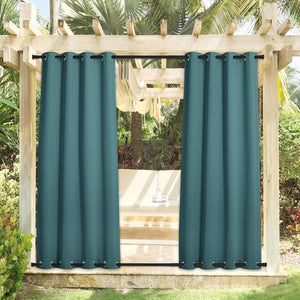 Teal outdoor privacy curtains with black grommets on top and bottom rods of a wooden pergola.