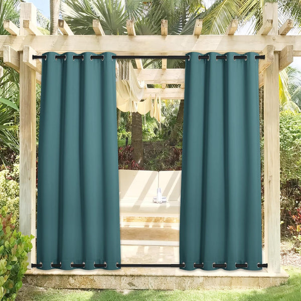Teal outdoor privacy curtains with black grommets on top and bottom rods of a wooden pergola.