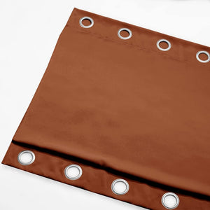 Terracotta brown blackout curtain panel, featuring shiny silver metal grommets along the top edge.