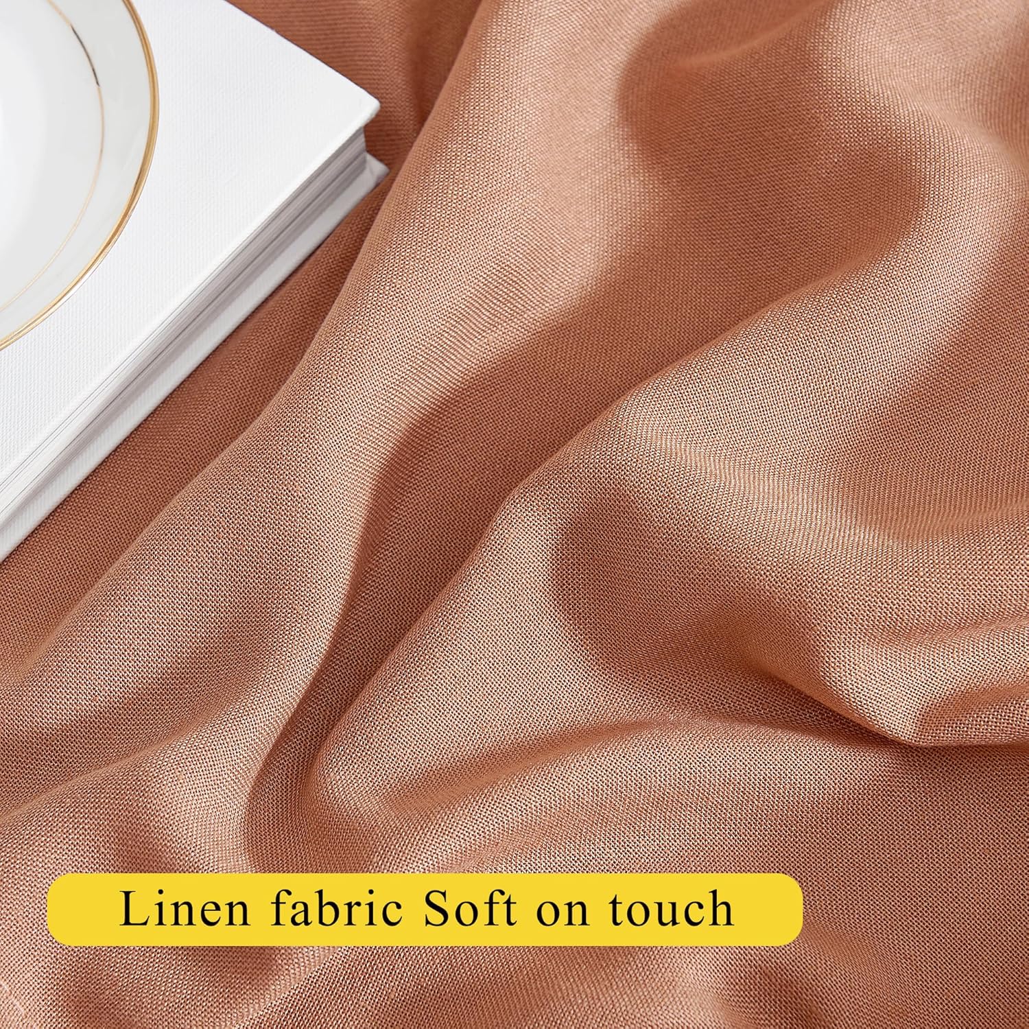 Close-up of soft terracotta brown linen fabric displaying a natural woven texture.