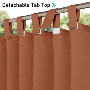 Close-up of terracotta solid curtains with detachable tab tops on a silver rod, showing hook-and-loop fasteners.
