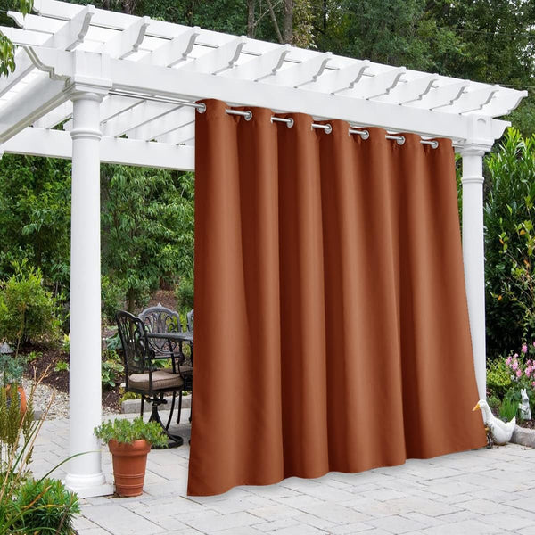 Terracotta outdoor grommet curtain on white pergola, providing shade and privacy for patio seating.