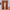 A pair of terracotta curtain panels with a ruffled rod pocket top and attached scalloped valance.