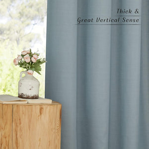 Thick light blue textured curtain panel, showing its prominent vertical drape and visible weave.