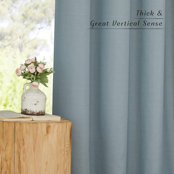 Thick light blue textured curtain panel, showing its prominent vertical drape and visible weave.