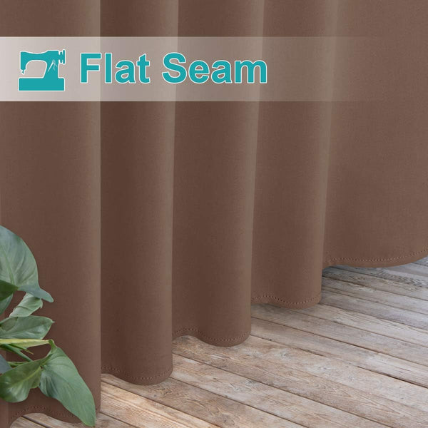 Warm brown curtain with flat seam detail and elegant scalloped hem near a plant on light wood flooring.