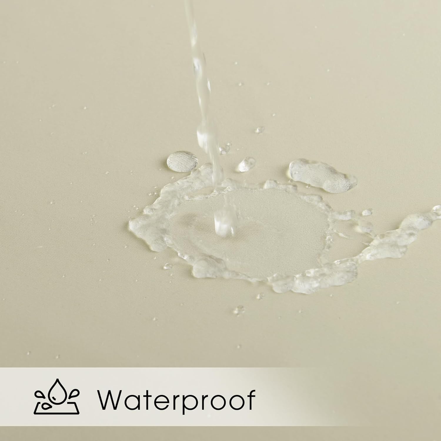Close-up of water beading up on a light beige waterproof fabric, demonstrating its water-repellent quality.