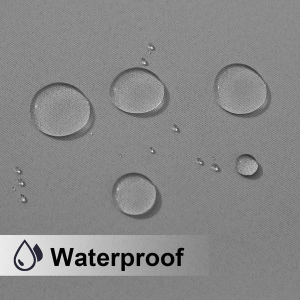 Close-up of a gray fabric surface with multiple clear water droplets, visibly demonstrating its waterproof property.