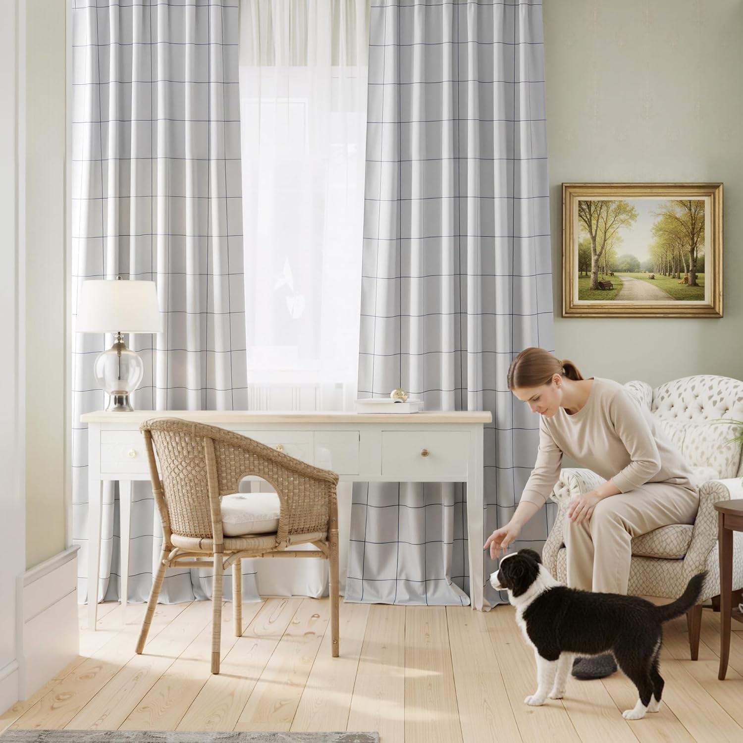 White and black grid pattern window curtains in a bright home office with light wood floors.