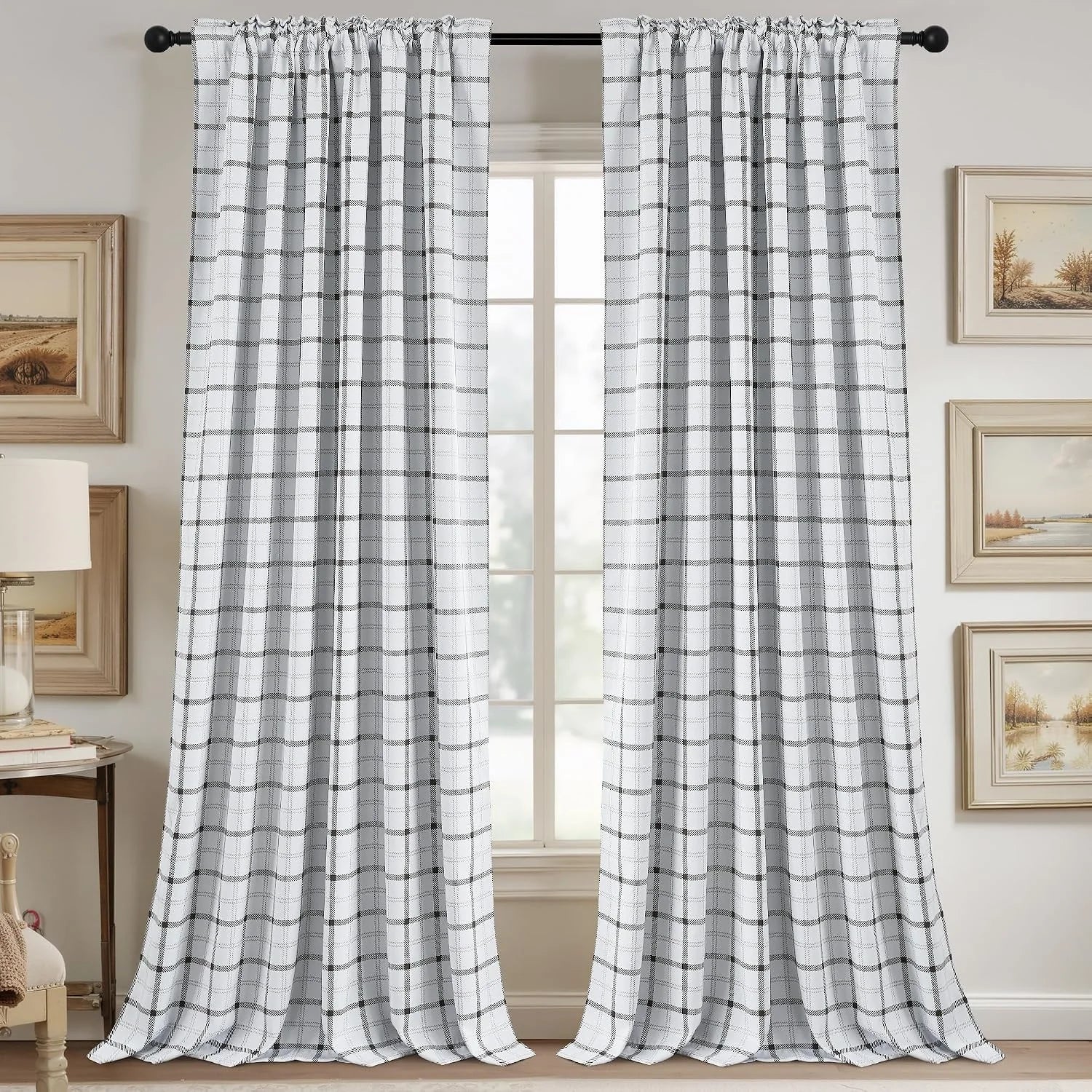 White plaid window curtains with black grid pattern on a rod in a neutral room