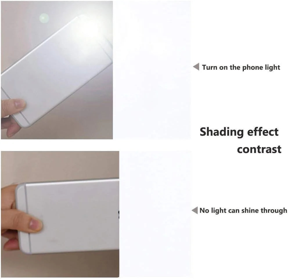 White blackout fabric compared with phone flashlight showing strong light-blocking effect