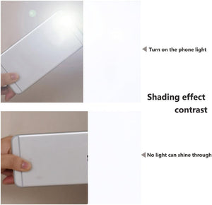 White fabric swatch shown blocking phone light completely, demonstrating its superior blackout feature.