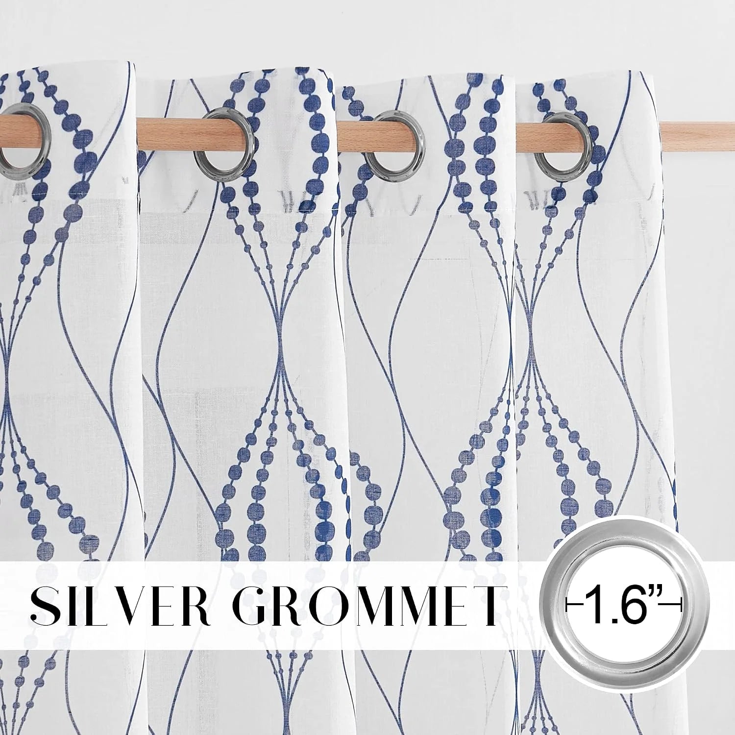 White sheer curtain with blue geometric vine pattern and silver grommet top