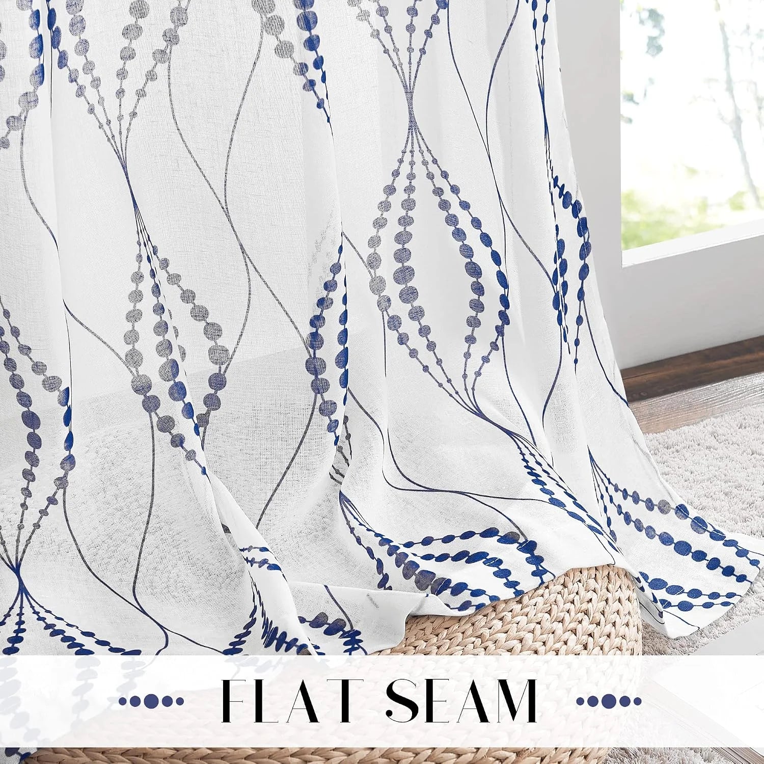 White sheer curtain with blue embroidered wave pattern and flat seam detail