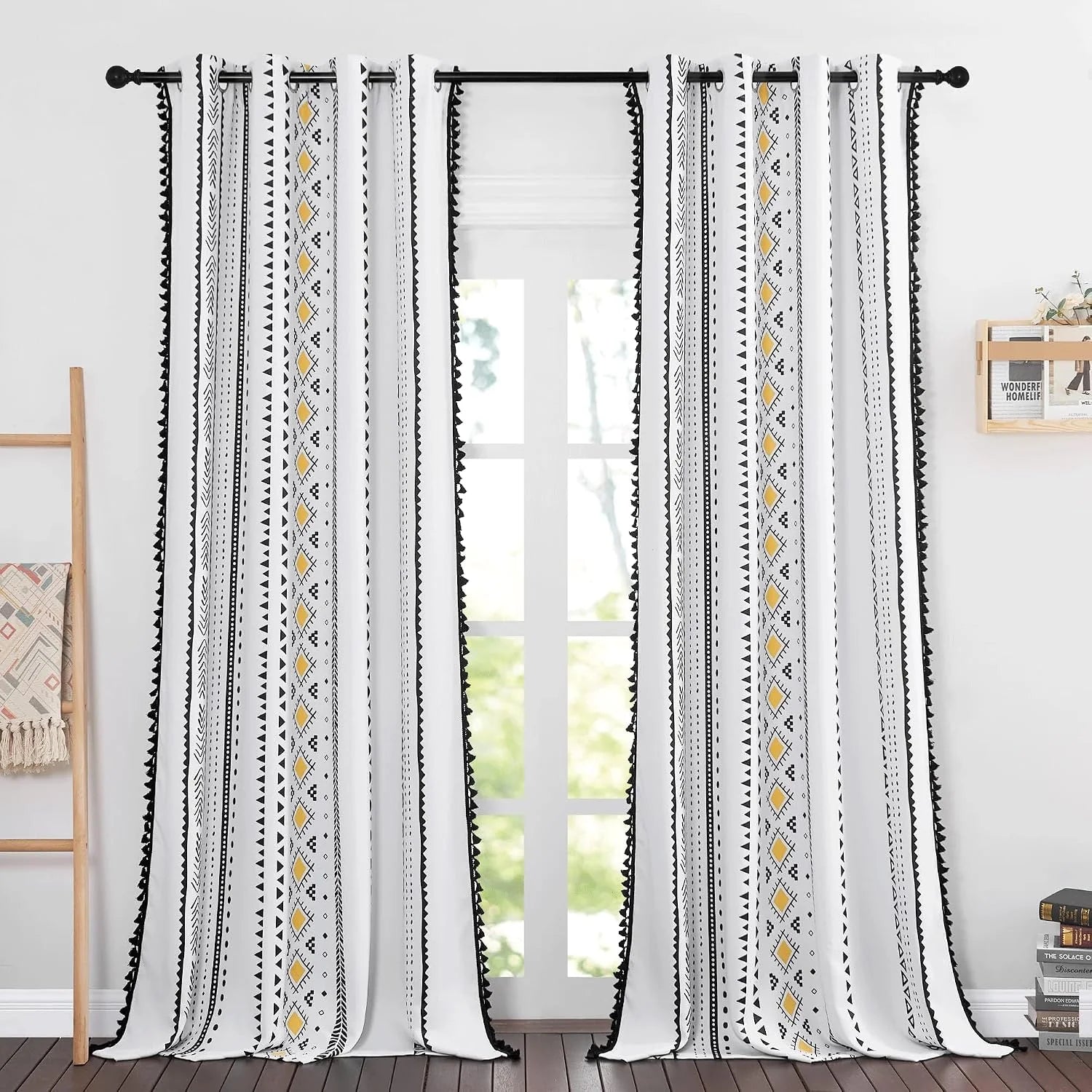 White boho curtains with black geometric print, yellow accents, and tassel trim