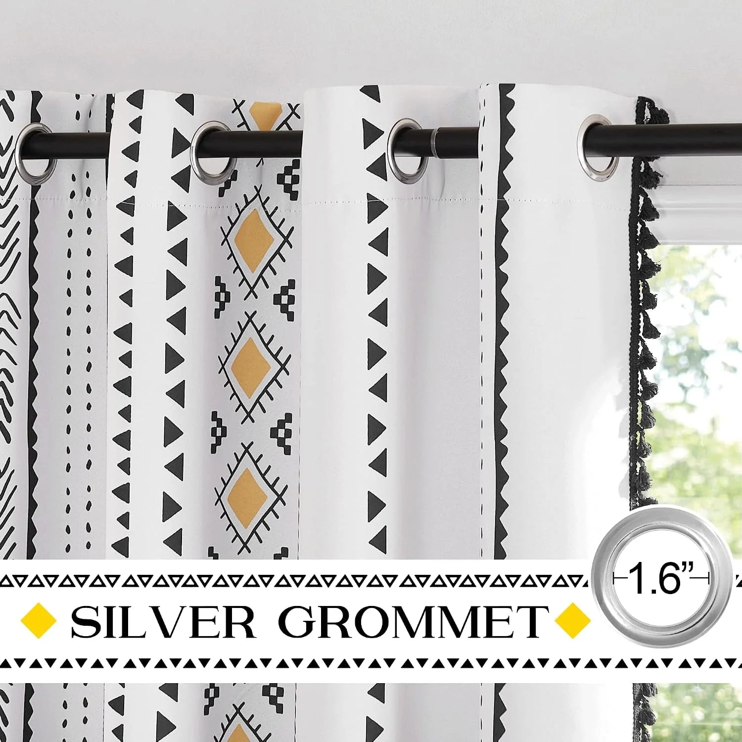White boho patterned curtains with silver grommets and black tassel trim
