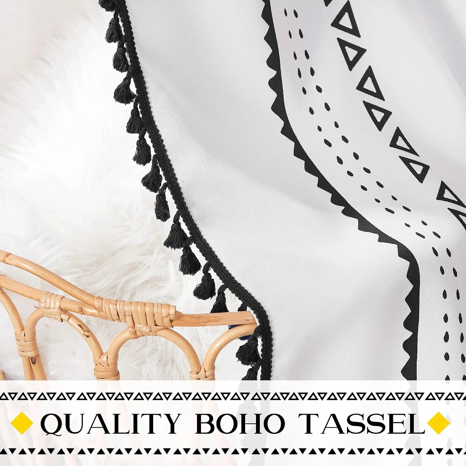 White boho textile wall hanging with black tassel trim and geometric print