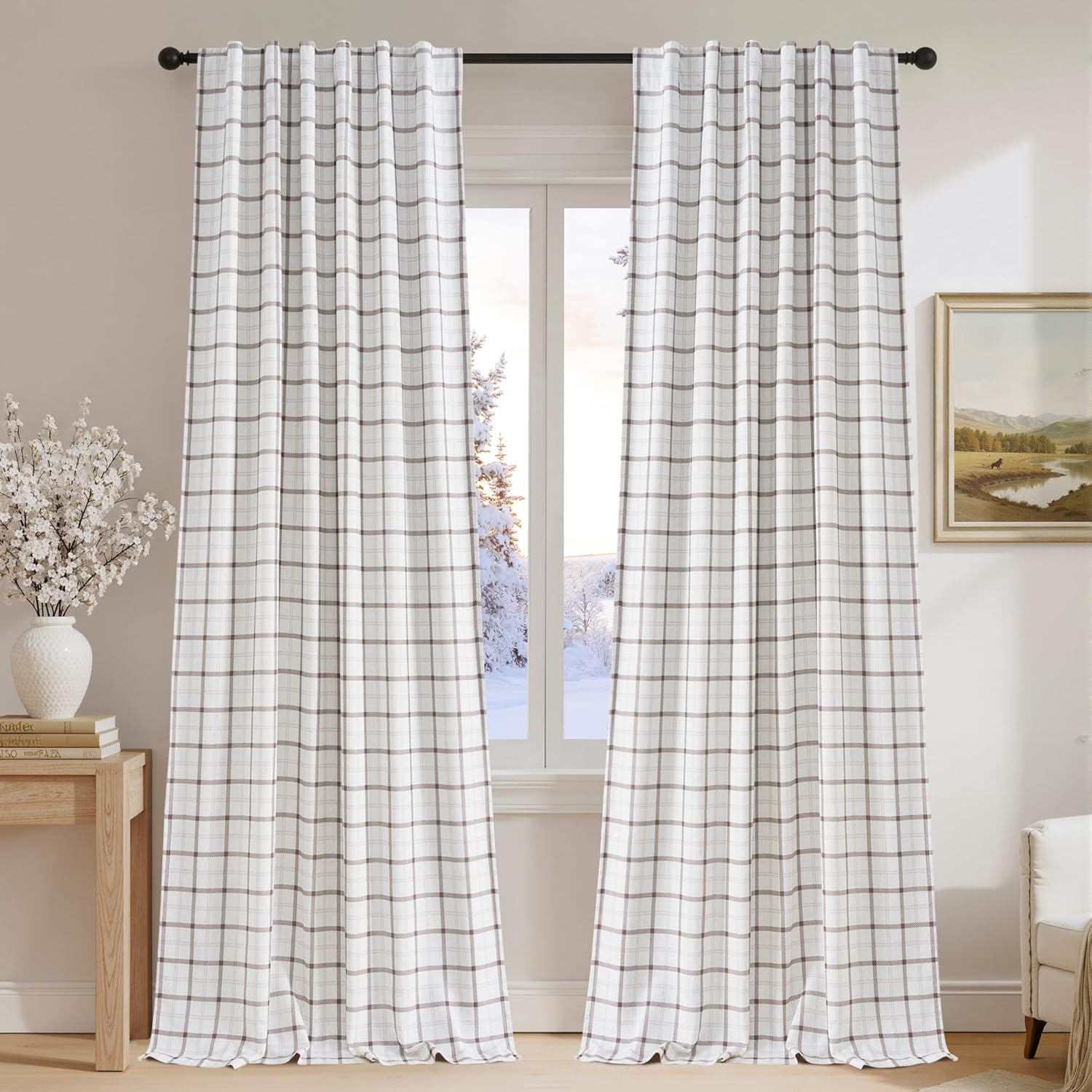 Neutral white curtains with brown and grey plaid pattern, tab top design, in a living room.