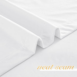 Crisp white fabric with a finely finished, neat seam along the hem, highlighting quality stitching.